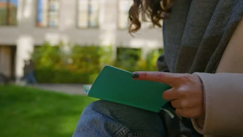 Student make paper notes in diary on street Stock Footage 170007912