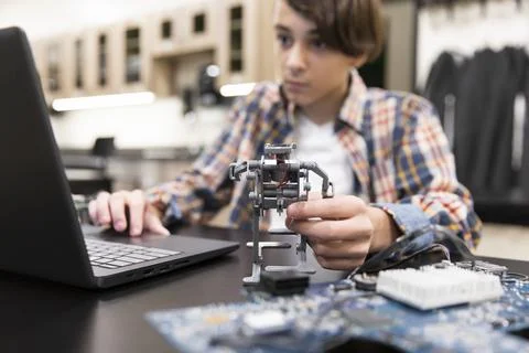 Student making robot in IT class 写真素材
