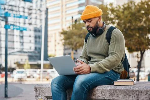Student, man and computer in city for college application, university research Foto stock