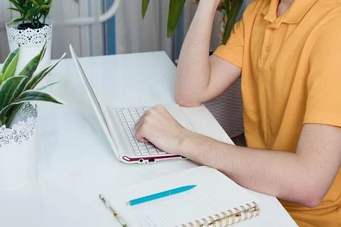 Student man hand using laptop computer for online study class at home Stock Photos