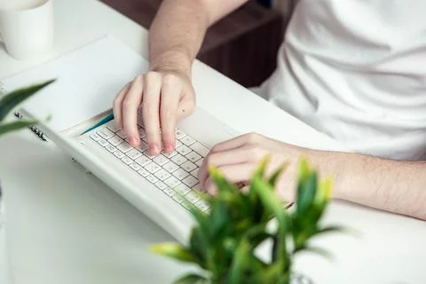 Student man hand using laptop computer for online study class at home Stock Photos