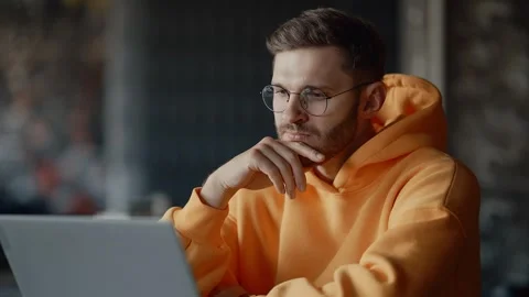 Student Man Looking At Display Of Laptop And Thinking, E-Learning And Distant Stock-Footage 343669524