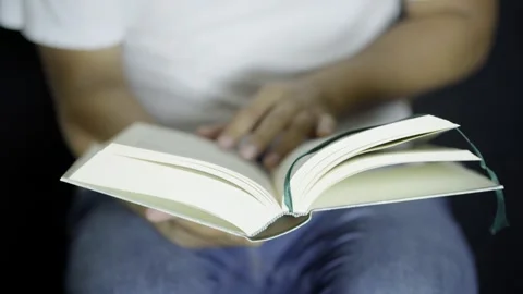 Student Man Reading A Book, Turning The Pages And Searching For Information Stock Footage 272477306