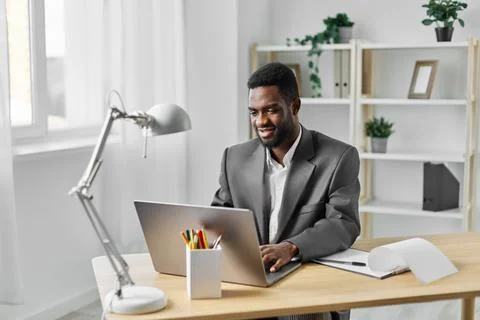 Student man technology computer education office job online laptop african Foto stock