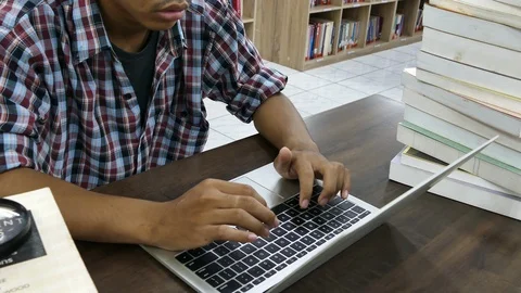 Student man using laptop at library, Education concept Stock Footage 116905742