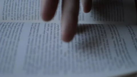 Student man's hand opening book for knowledge. turning book's page Stockbeeldmateriaal 205075449