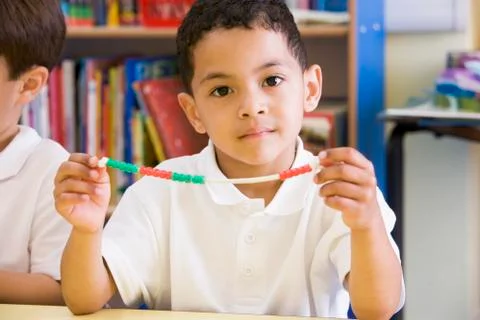 Student in math class with counting beads Stock Photos