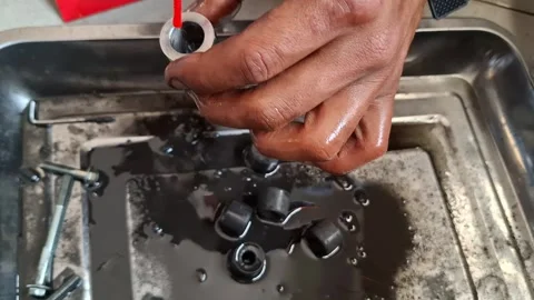 Student Mechanic Cleaning Motorcycle Engine Parts in Workshop Stock Footage 328909687