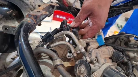 Student Mechanic Practicing Motorcycle Engine Inspection in Workshop Stock Footage 319609406