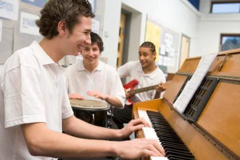 Student musicians practising in classroom Stock Photos