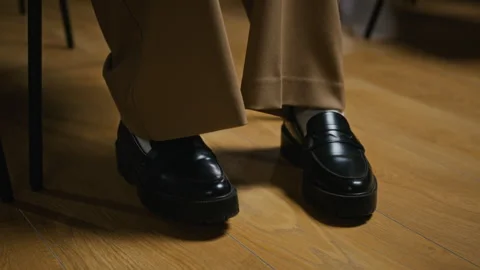 Student Nervously Tapping Feet While Waiting for Theater Audition Stock Footage 344518235