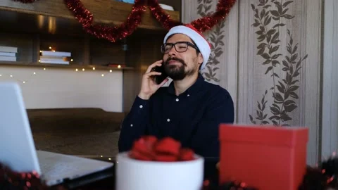 A student on New Year's Eve communicates via smartphone with parents or friends. Stock Footage 143731076