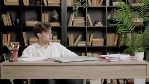 Student in no mood to study and prepare for exams and tests. Boy with glasses Stock Footage 316090859