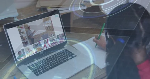 Student opening laptop for remote class, writing notes as instructor gesturing, Stock Footage 314848520