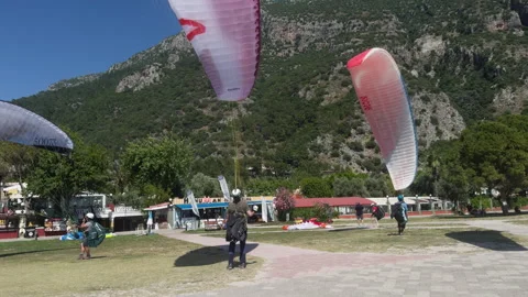 Student paragliders practice with parachutes. Stock Footage 312191398