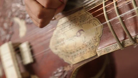 A Student performing and playing Indian traditional musical instrument "Sitar". Stock Footage 112965583