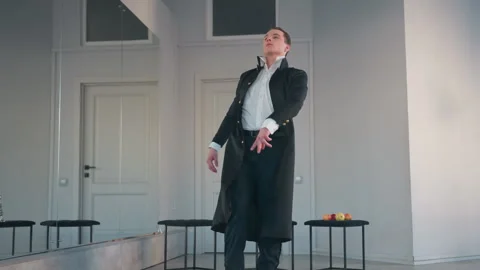 Student Performing Dramatic Solo Dance in Minimalist Studio with Apples and Stock Footage 308665195