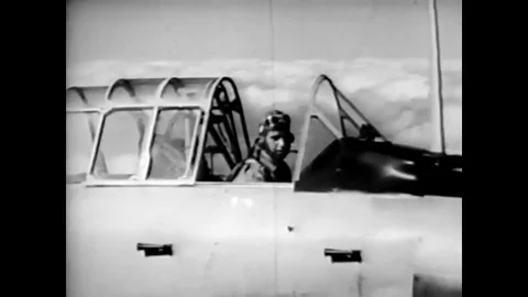 A student pilot flying a trainer aircraft repeatedly executes a slow roll aerial Stock Footage