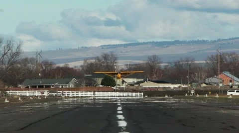 Student Pilot Landing Small Airplane on Rural Runway Stock Footage