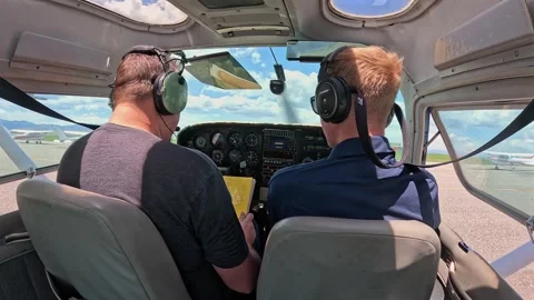 Student Pilot Pre-Takeoff Checklist with Instructor Stock Footage 296589615