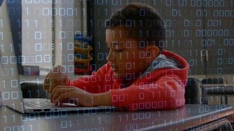 Student placing hands on laptop and typing in classroom, binary overlaying Stock Footage 334337980