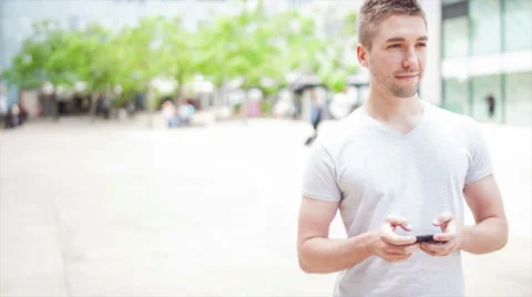 Student playing with electronic device, looking around Stock Footage 39343132