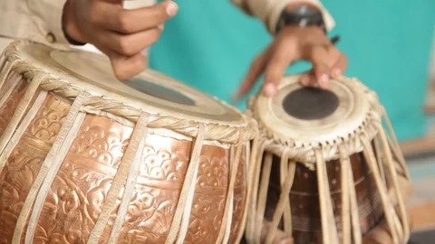 A Student playing Indian traditional musical instrument "Tabla". Stock Footage