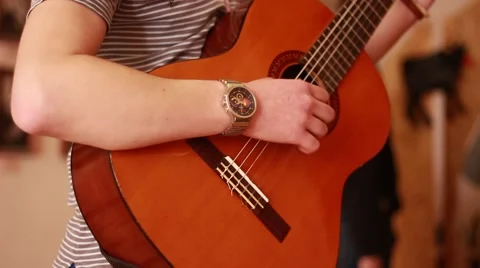 Student plays guitar Stock Footage 62019946