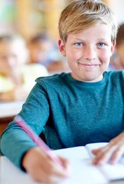 Student, portrait and writing notes for learning in classroom, boy and problem 写真素材