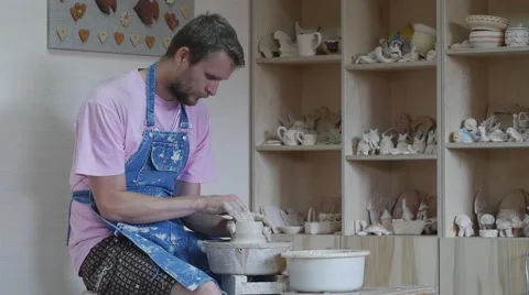 Student Potter is Rotating a Wheel Making a Vase Working on a Pottery Wheel Stock Footage 57991578