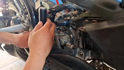 Student Practicing Motorcycle Engine Maintenance in Workshop Stock Footage 319606438