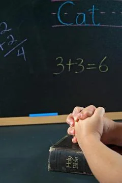 Student praying in school Stock Photos