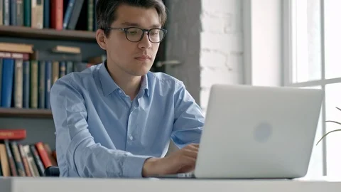 Student preparing exam and learning lessons in school library, making research Stock Footage 97555613