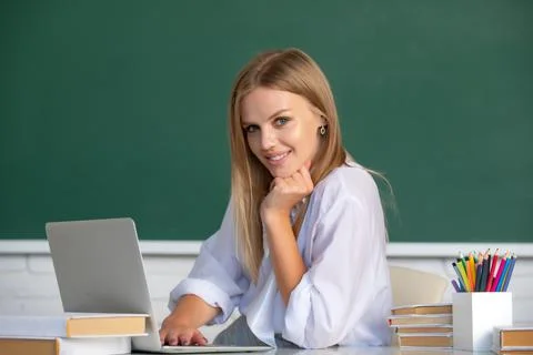 Student preparing exam and learning lessons in school classroom. Beautiful Stock Photos