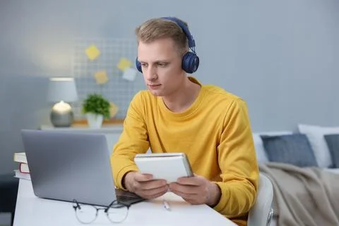 Student preparing for exam with laptop at table indoors Stock Photos