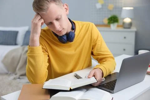 Student preparing for exam at table indoors Stock Photos