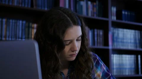 A student preparing for exams in the library. Close-up. 4K Stock Footage 63503229