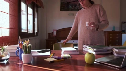Student preparing to start a study session on her bedroom. Stock Footage 145811436