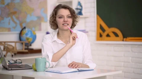 Student preparing for test or exam. Funny female young teacher in the classroom. Stock Footage 138065337