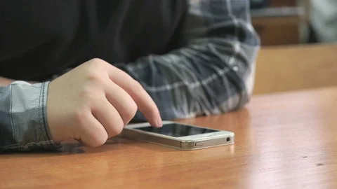 Student pressing finger on screen of smartphone Stock Footage 82806277