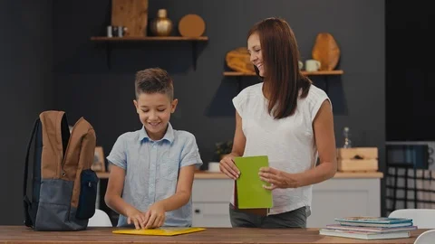 The student puts in a backpack notebooks and textbooks. Back to School. Stock-Footage 92498586