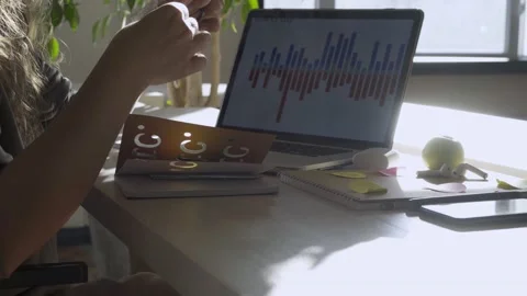 Student puts on glasses and writes notes in paper notebook Stock Footage 147433204