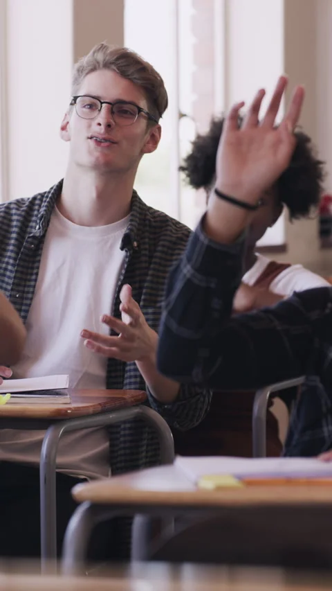 Student, question and raised hands with boy in classroom for learning, knowledge 스톡 동영상 327010071