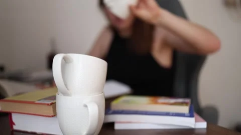 Student reaches for another cup of coffee Video stock 341233643