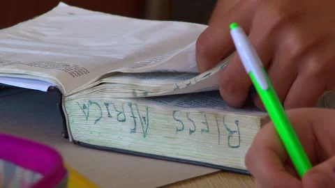 Student Reading A Bible In Class Stock Footage 156765418