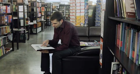 Student reading a book in the library. Concept: educational, portrait, library Stock Footage 86200958