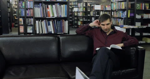 Student reading a book in the library. Concept: educational, portrait, library Stock Footage 86202974