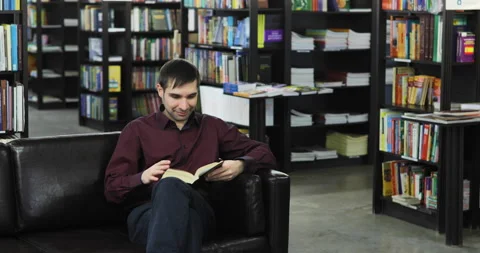Student reading a book in the library. Concept: educational, portrait, library Stock Footage 86209329