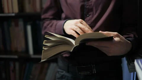 Student reading a book in the library. Concept: educational, portrait, library Stock Footage 86214393