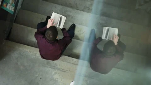 Student reading a book in the library. Concept: educational, portrait, library Stock Footage 86215020
